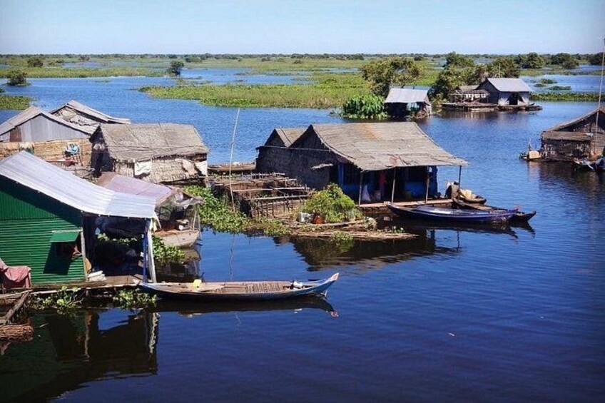 A water village with floating houses and boats. 5