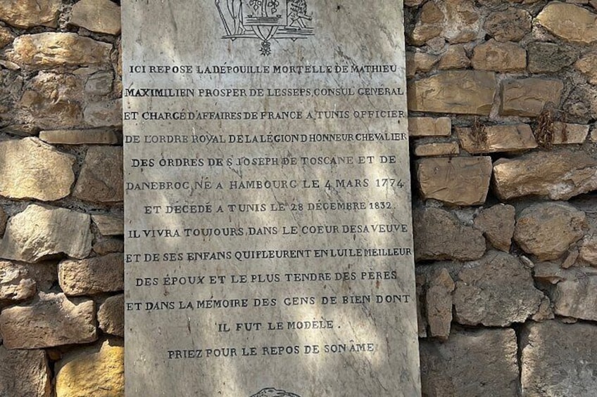 A stone wall with a plaque. 2