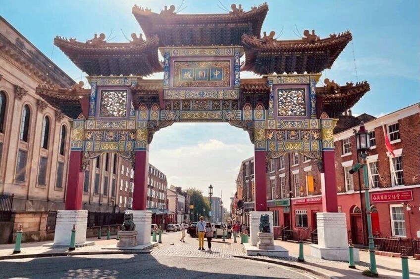 A traditional Chinese gate with intricate designs and a red and blue color scheme. 3