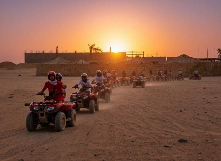 A group of people riding quad bikes on a dirt path during sunset. 3