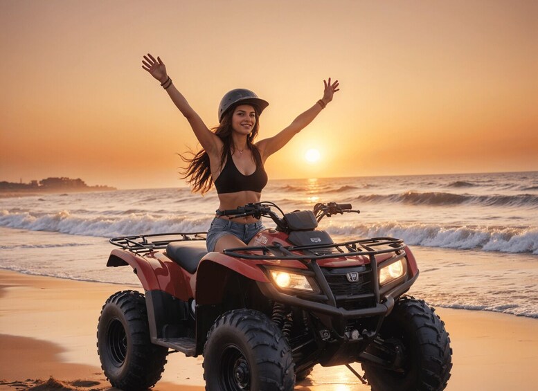 A person on an ATV at the beach during sunset. 1