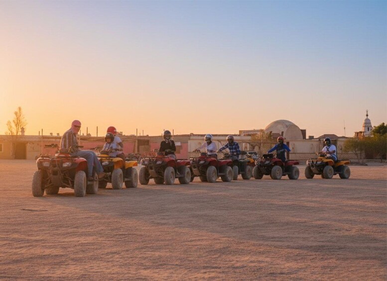 A group of people riding atv's in a line formation. 3