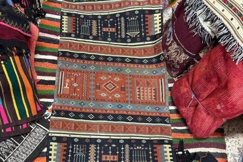 A collection of colorful woven textiles with intricate patterns. 4
