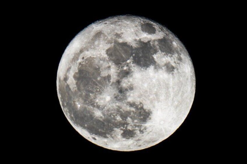 A detailed view of the moon's surface with visible craters and maria. 5