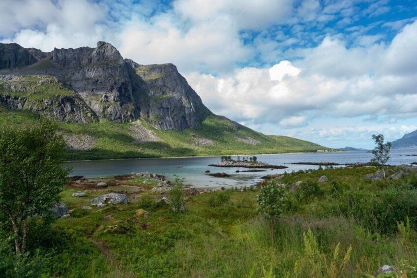 A mountainous landscape with a lake and rocky terrain. 1