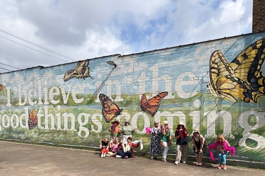 A mural with butterflies and the phrase 'I believe in the good things coming.' 3
