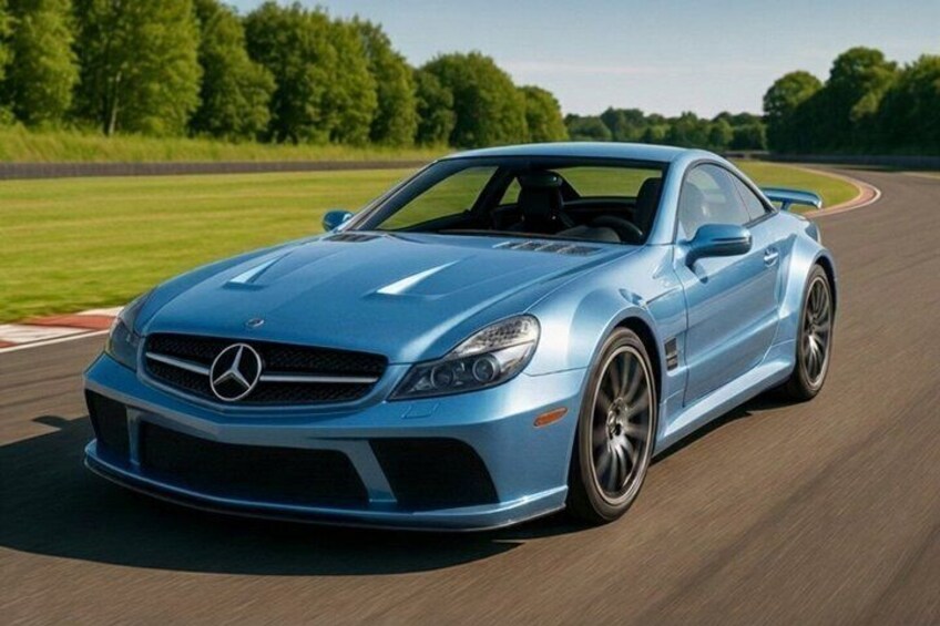 A blue sports car on a racetrack. 1