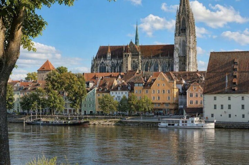 A river with buildings and a church. 4
