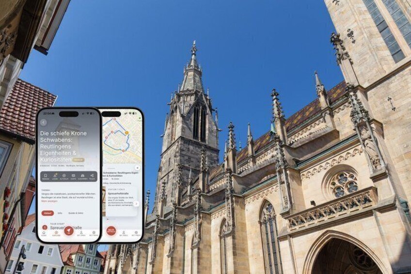 A historic cathedral with Gothic architecture, a smartphone displaying a map, and a clear blue sky. 1