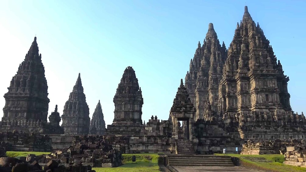 A temple complex with multiple tiered towers and intricate stone carvings. 4