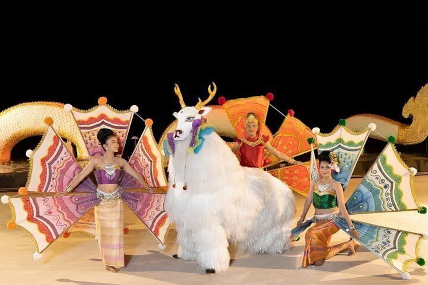 A traditional performance with performers in elaborate costumes and a large white horse. 3