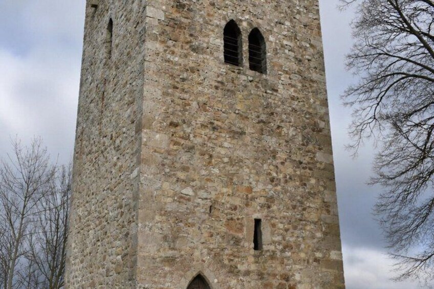 A tall stone tower with arched windows. 3