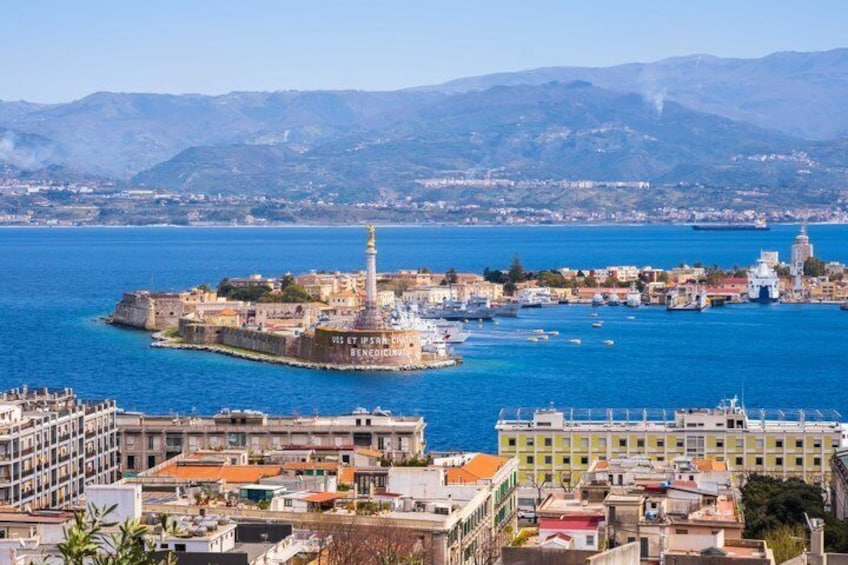 A coastal cityscape with a prominent island featuring a lighthouse, a harbor with boats, and a mix of historical and modern buildings. 3