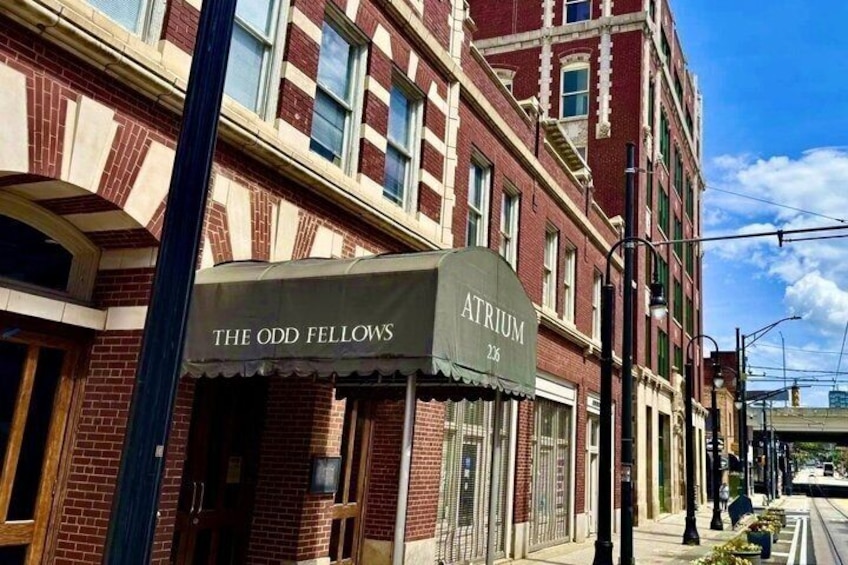 A brick building with a sign that reads 'The Odd Fellows Atrium 2nd Floor.' 1