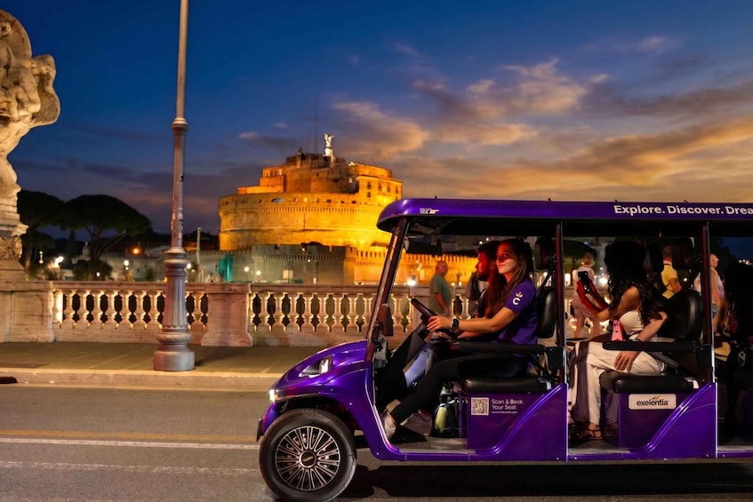 A purple tour vehicle with passengers, a historic building in the background, and a classical statue in the foreground. 1