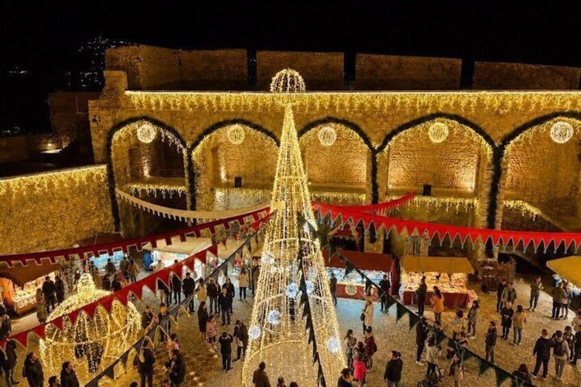 A decorated historical building with arches and a central structure. 2