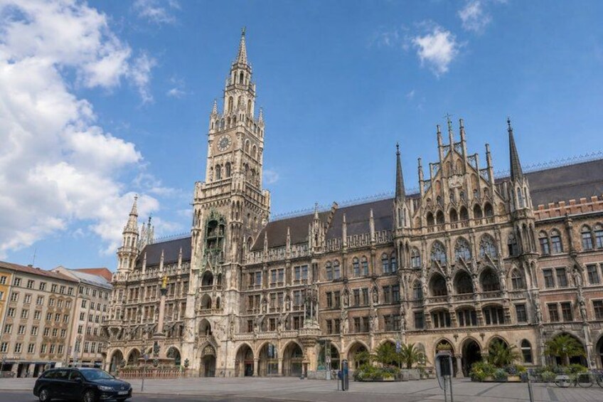 A historic building with intricate architecture, including a prominent tower and arched windows. 5