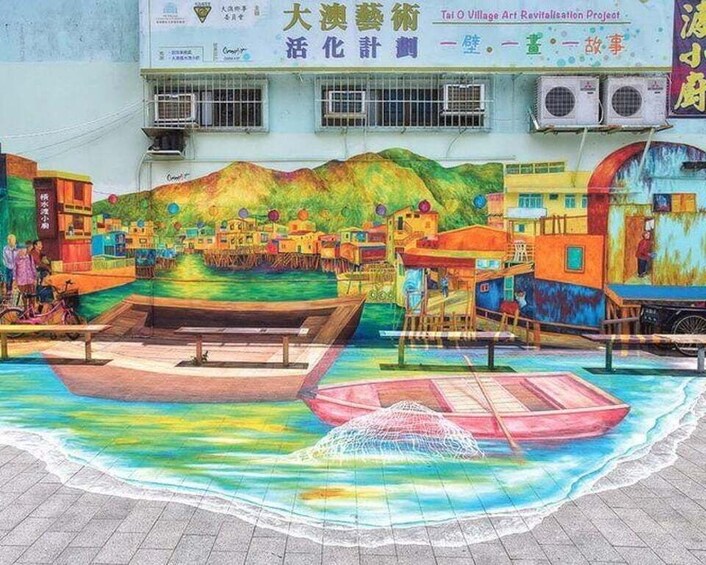 A colorful mural of a village scene with boats on water, buildings, and mountains. 5