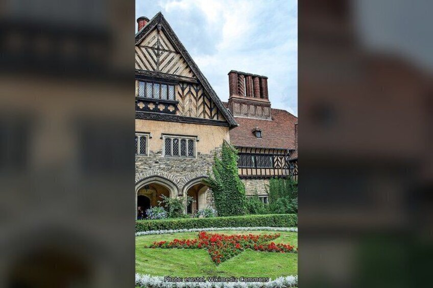 A Tudor-style building with a garden in front. 5