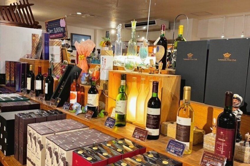 A wine shop with various bottles and boxes of wine. 3