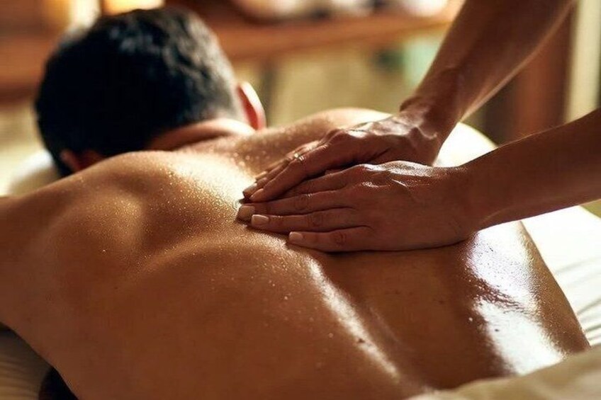 A person receiving a back massage. 4