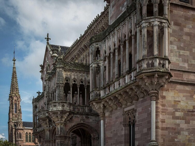 A historic cathedral with intricate Gothic architecture, including pointed arches and detailed stonework. 1