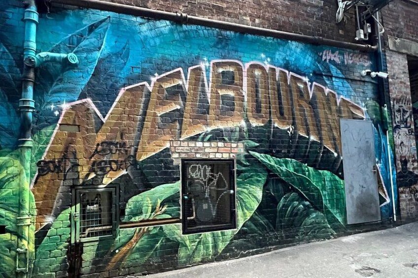 A mural with the word 'MELBOURNE' and a door. 2