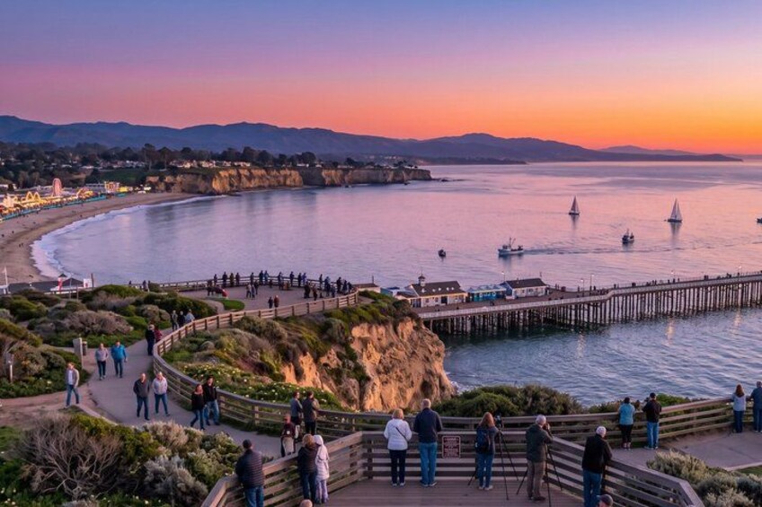 A coastal sunset with a pier, people walking, and sailboats on the water. 2