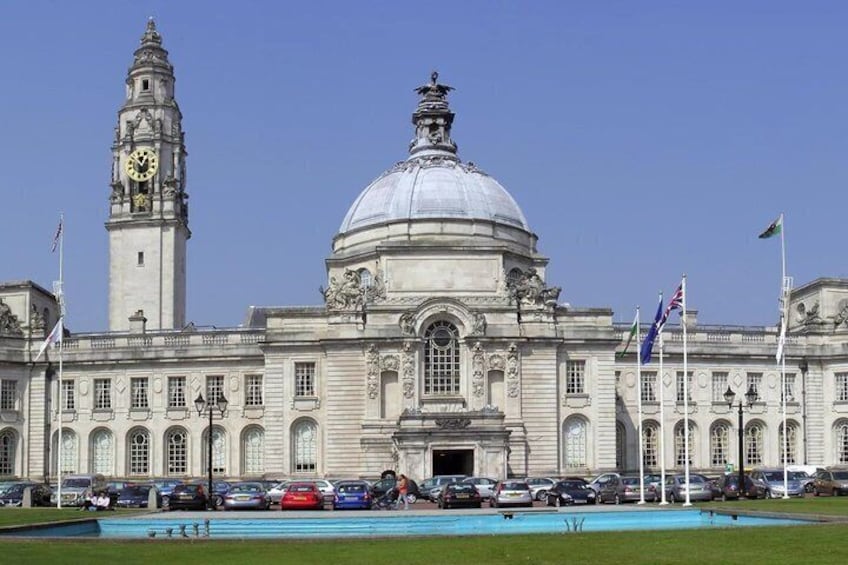 A large historic building with a prominent dome and clock tower. 1