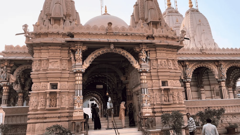 A temple with intricate carvings and multiple domes. 5