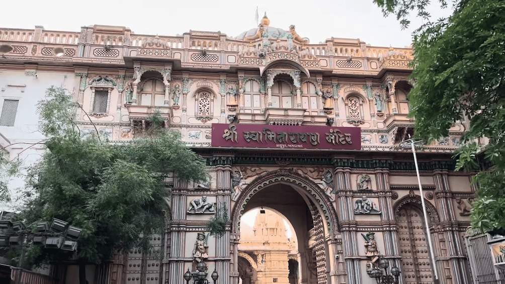 An ornate historical building with intricate carvings and a large archway. 4