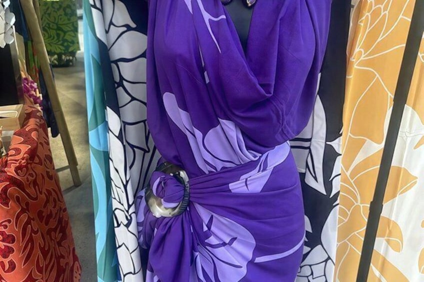 A purple dress with a bow detail and a belt. 4