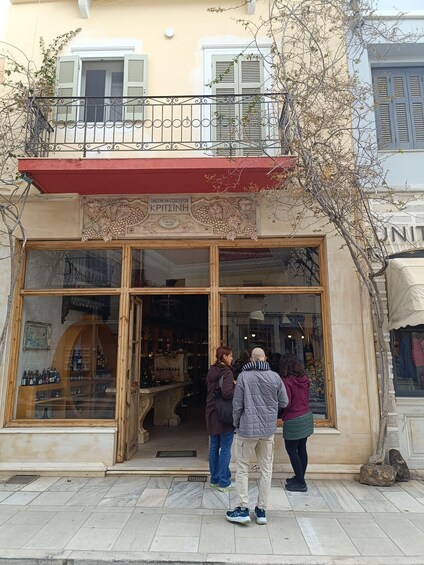 A storefront with large glass windows displaying various items. 5