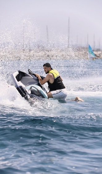 A person riding a jet ski in the water. 3