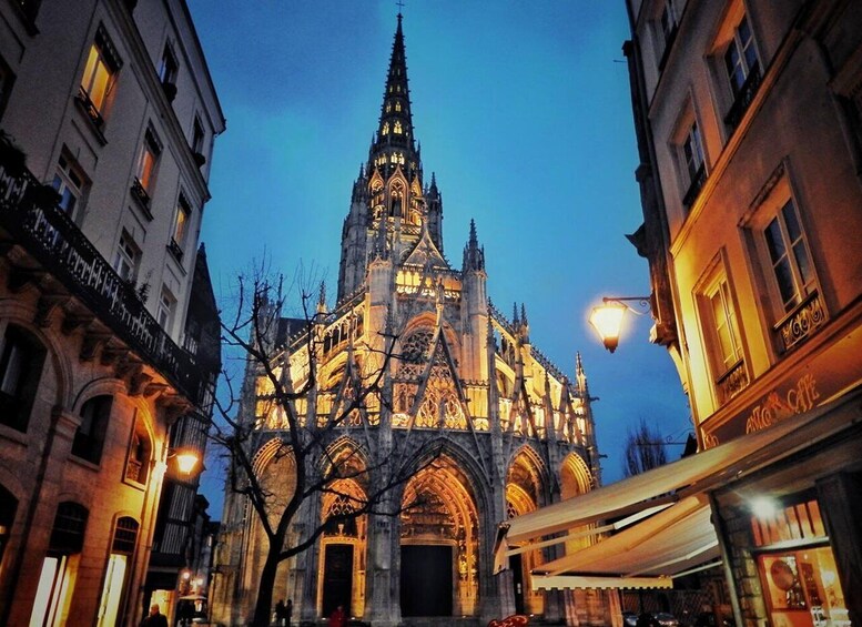 A Gothic cathedral with intricate architecture, illuminated by street lamps. 4