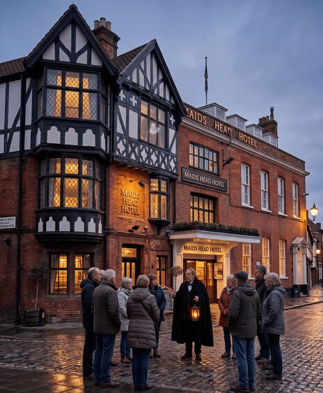 A historic building with a sign reading 'MAIDS HEAD HOTEL'. 5