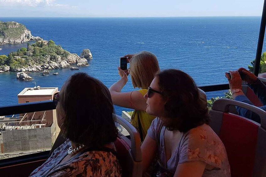 A coastal view with a rocky island and the sea. 1