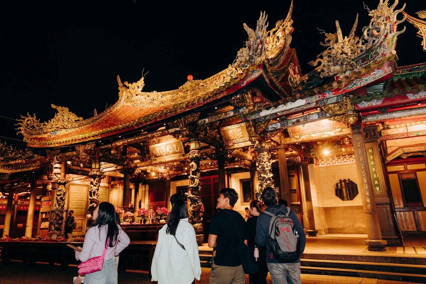 A traditional temple with ornate golden roofs and intricate decorations. 3