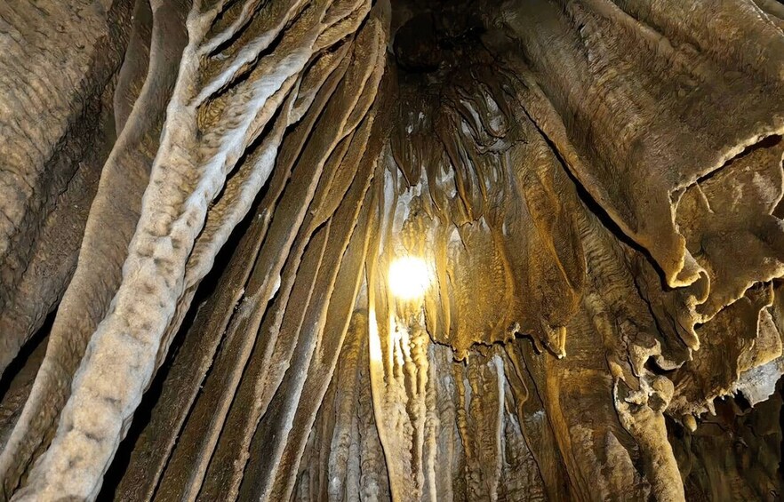 A cave with stalactites and stalagmites. 5