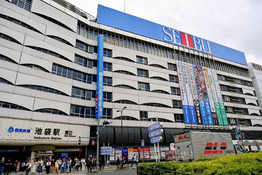 A multi-story building with a prominent 'SEIBU' sign. 2