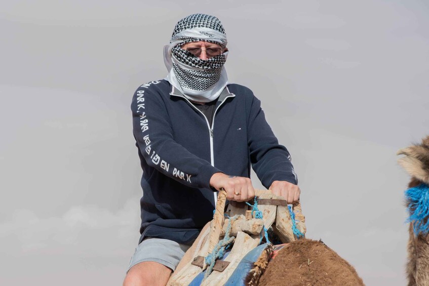 A person riding a camel. 2