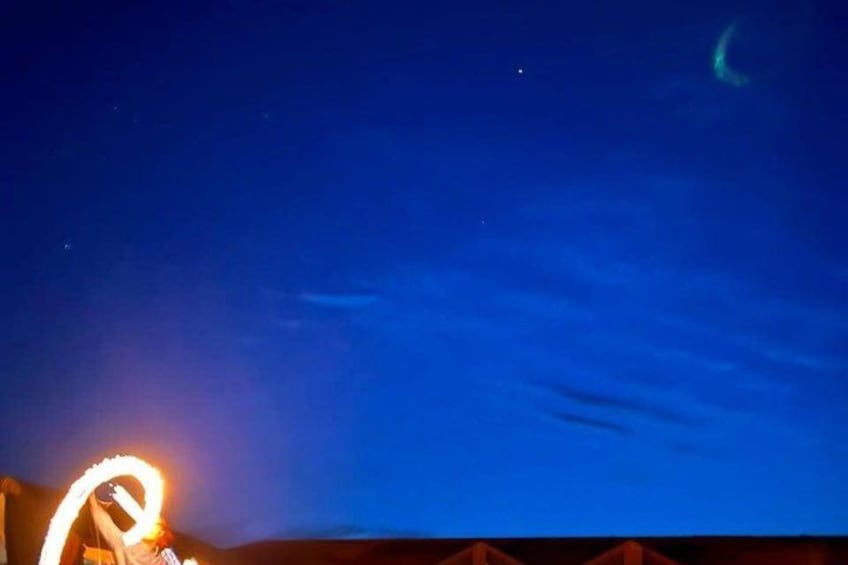 A night sky with stars and a crescent moon. 3