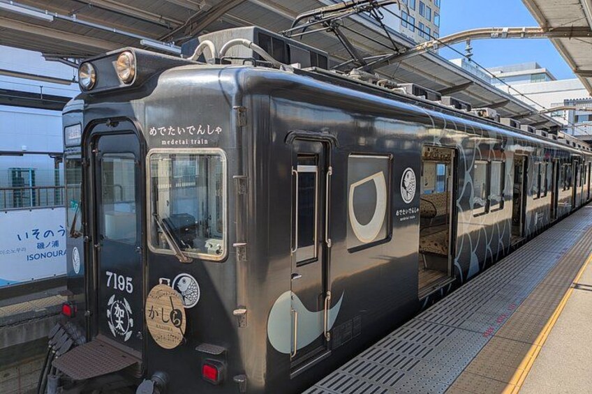 A train at a station with a platform. 2