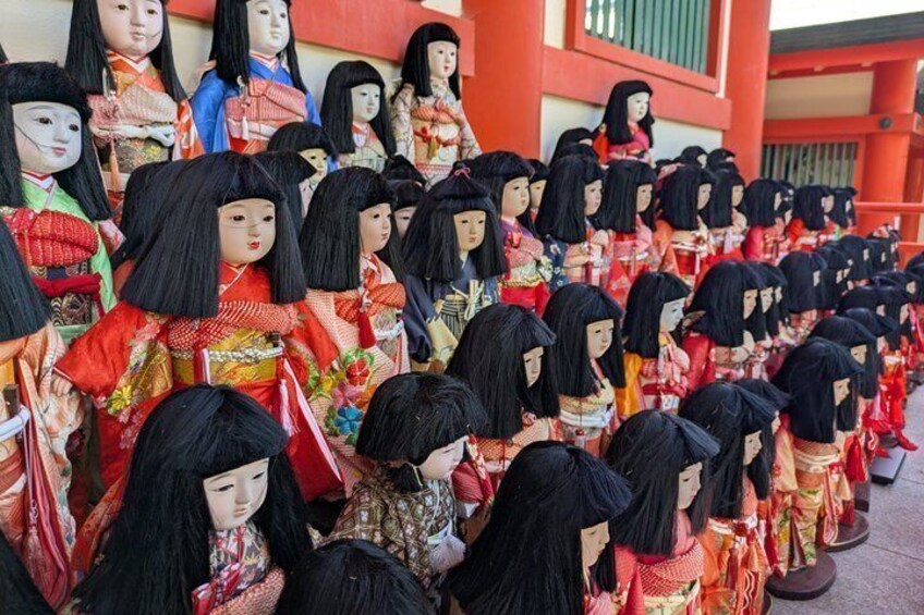 A collection of dolls in traditional attire. 5