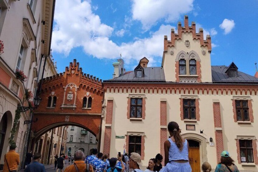 A historic building with a red brick facade and a tower with a clock. 4