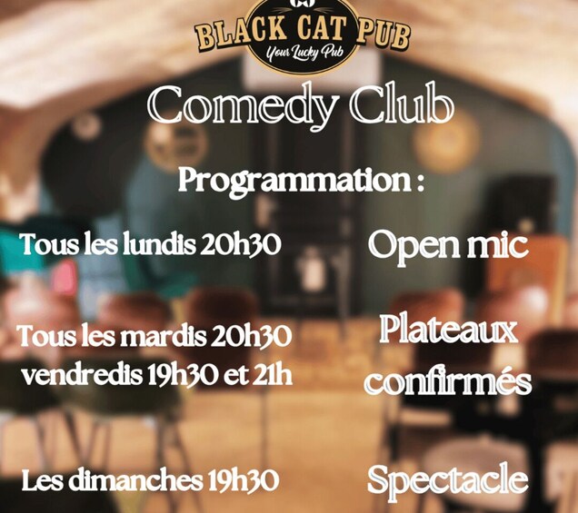 A comedy club with programming details at Black Cat Pub. 1
