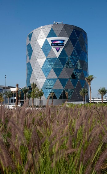 A modern building with a geometric facade and a logo that reads 'STORM COASTER'. 3