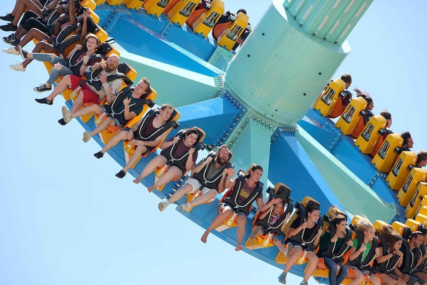 A group of people on a spinning amusement ride. 5