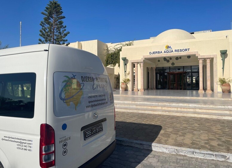 A white van parked in front of the Djerba Aqua Resort. 2