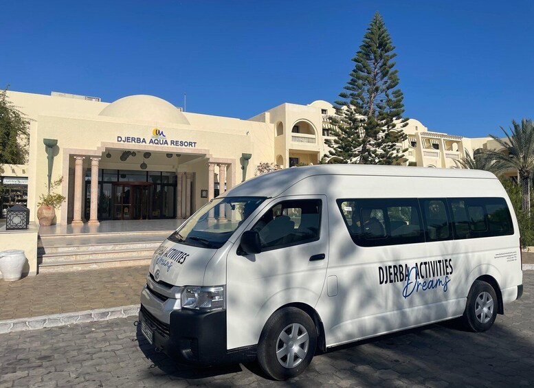 A white van parked in front of DJERBA AQUA RESORT. 5
